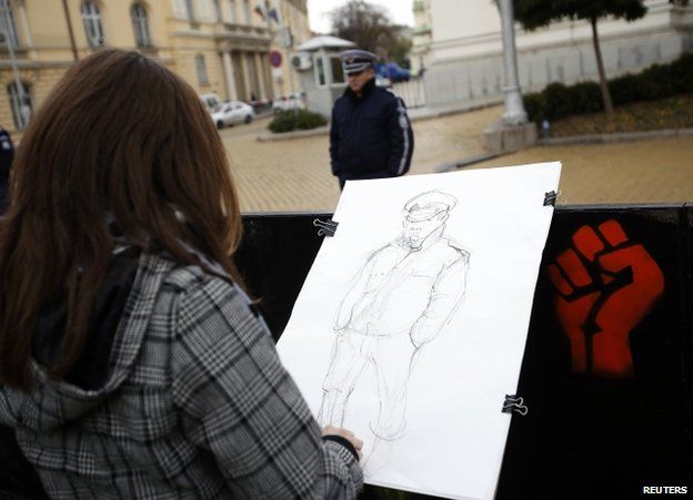 A student sketches a policeman during a protest in Sofia, Bulgaria 13 November