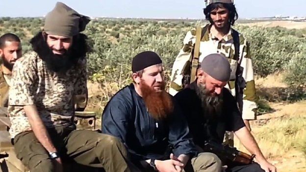 Omar Shishani (centre) and other Chechen fighters in Syria