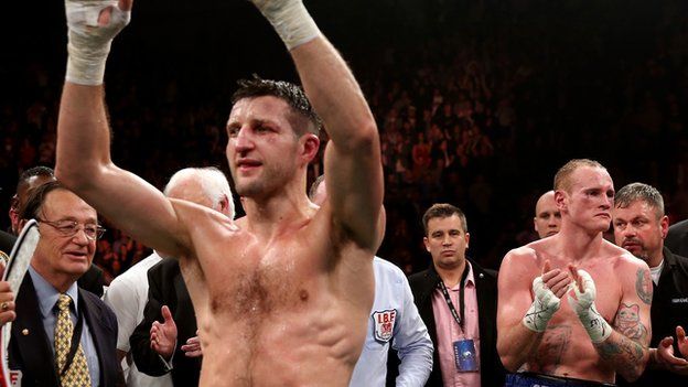 Carl Froch celebrates after beating George Groves