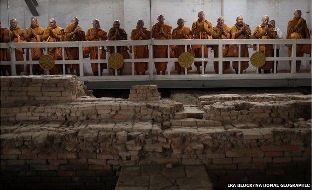 Thai monks inside the Maya Devi Temple meditate over the remains of the oldest Buddhist shrine in the world
