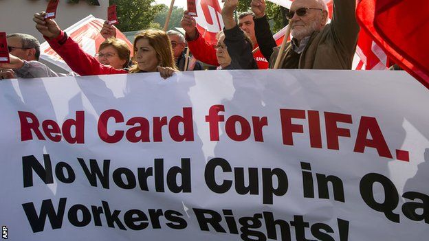 Members of Building and Wood Workers' International (BWI) and Swiss Unia unions protest to Fifa over workers' rights in Qatar