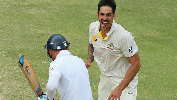 Mitchell Johnson celebrates taking Stuart Broad's wicket