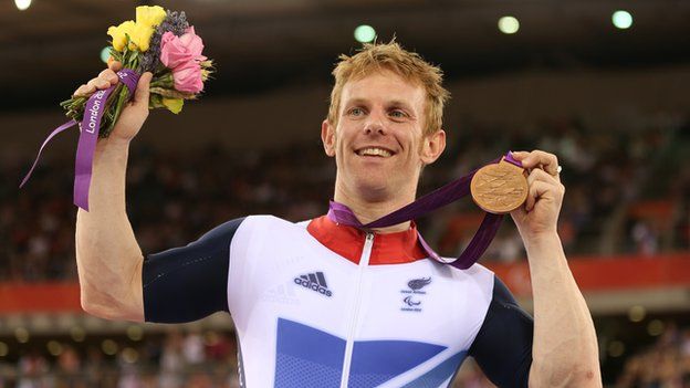 Jody Cundy celebrating his bronze medal at the Paralympics