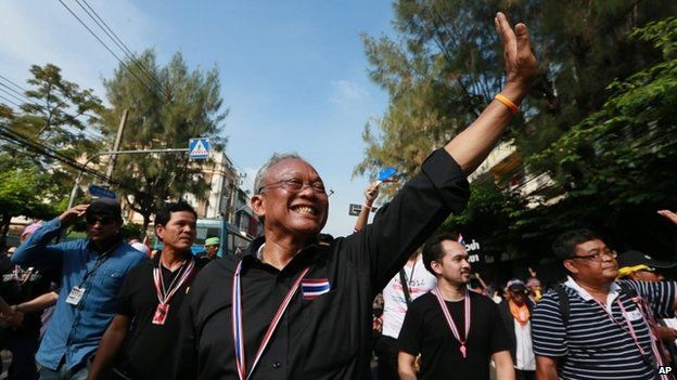 Suthep Thaugsuban waves to supporters during an anti-government march to the Government complex in Bangkok, Thailand, 27 November 2013