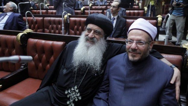 A representative of the Coptic Orthodox Church, Bishop Bola (left) and Egypt's Grand Mufti Shawqi Allam (right) inside the Shura Council (30 November 2013)