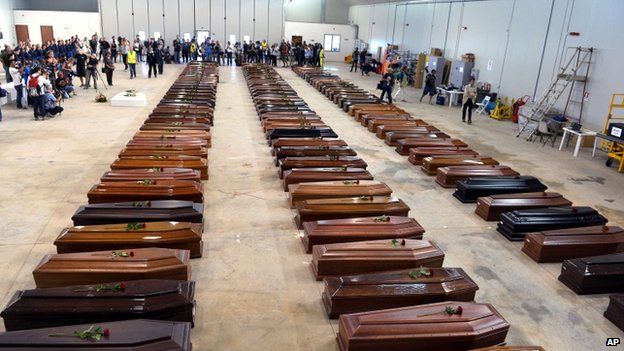 Coffins of migrants who drowned off Lampedusa on 3 October, laid out at Lampedusa airport, southern Italy