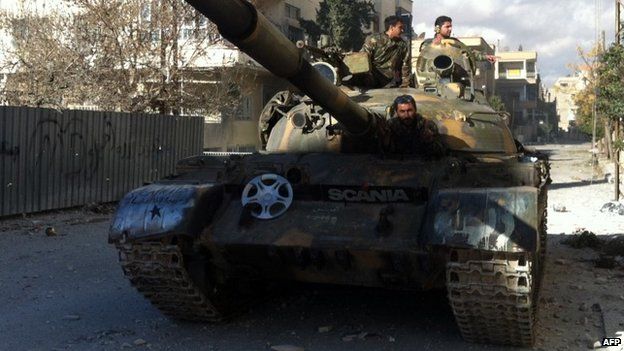 Syrian pro-government forces patrol Nabak in a tank (7 December 2013)