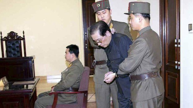 Jang Song Thaek, with his hands tied with a rope, is dragged into the court by uniformed personnel December 12, 2013 in this picture published in Rodong Sinmun December 13, 2013 and released by Yonhap