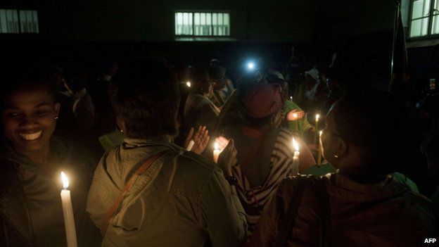 People light candles during a visit at Robben Island, off Cape Town, for an all night vigil to commemorate Nelson Mandela. Photo: 13 December 2013