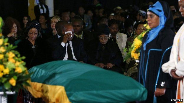 President Zuma flanked by Graca Machel (L) and Mandela's ex-wife Winnie Mandela