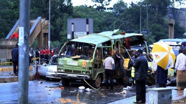 Damaged vehicles are seen at the scene of a blast near Pangani Police Station in Kenya's capital Nairobi, December 14, 2013.