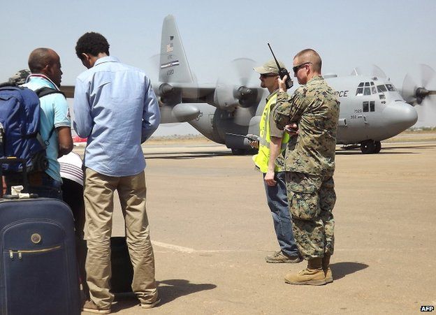 A US serviceman uses a radio at Juba's airport, 21 December