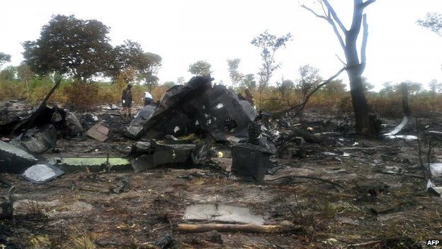 the burnt wreckage of a Mozambican Airlines plane at the site of its crash in Namibia"s Bwabwata National Park