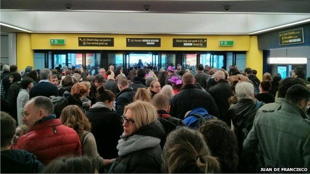 Crowds of travellers at Gatwick Airport