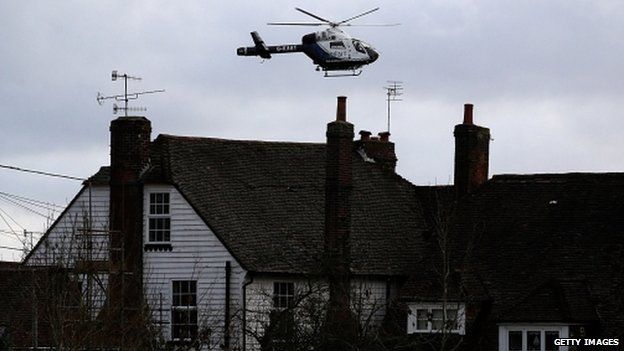 A helicopter flying over homes in Yalding