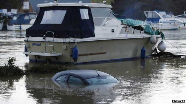 A submerged car next to a boat in East Farleigh, Maidstone, Kent