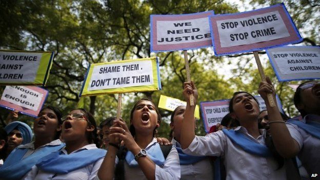 Indian students shout slogans as they hold placards demanding stringent punishment to rapists during a protest in New Delhi, India, Tuesday, April, 23, 2013