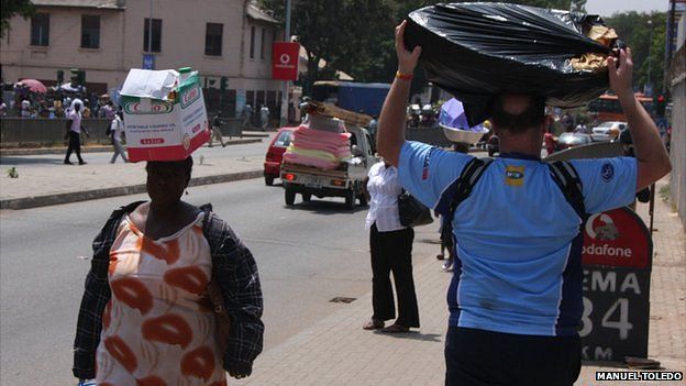 People carrying goods in Ghana