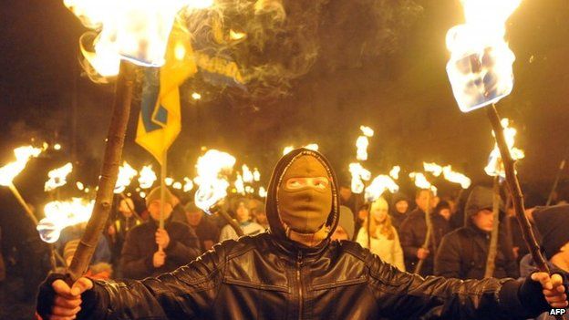Nationalists hold torches during a march in western Ukrainian city of Lviv