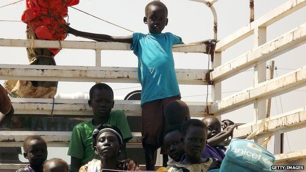 South Sudanese citizens from the Jonglei State are pictured on a truck in Juba on January 4, 2014 as they try to leave for Uganda.