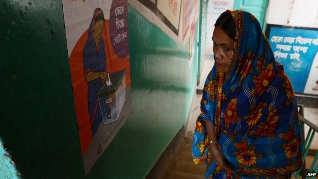 A Bangladeshi woman wanting to cast her vote looks for the polling booth she is registered to vote in at a polling station in Dhaka on January 5, 2014