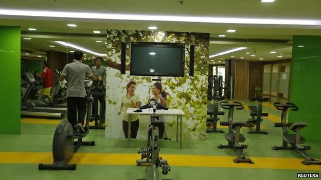Employees work out at a gym inside an office building in Noida on the outskirts of Delhi.