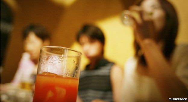 Young adults drinking juice