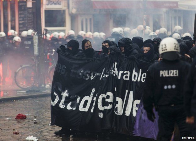 German riot police face protesters near the Rote Flora centre in Hamburg, 21 December