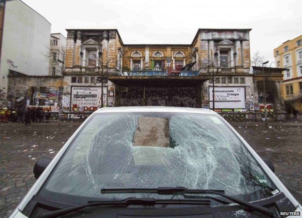 A vandalised car near the Rote Flora centre in Hamburg, 21 December