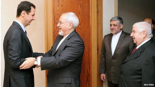 President Bashar al-Assad greets Iranian Foreign Minister Mohammad Javad Zarif in Damascus (15/01/14)