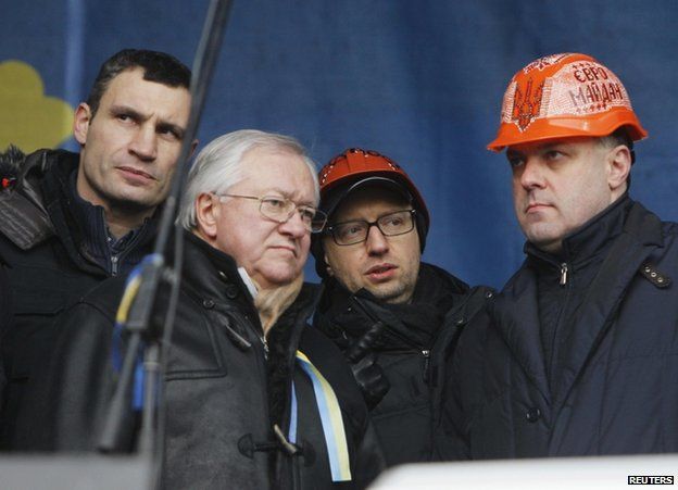 Speakers gather on stage at protest in Kiev, 19 January