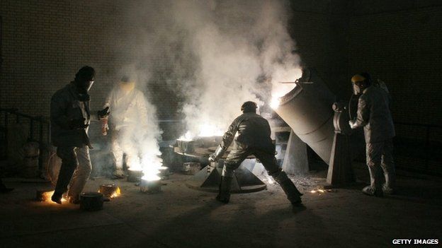 Men making uranium hexafluoride gas at the Isfahan uranium conversion facility (March 2005)