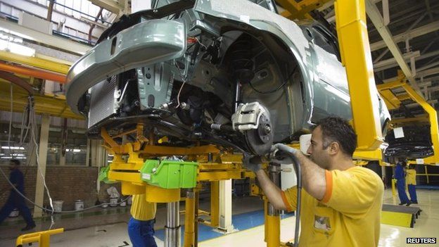 Men assembly a Tondar car at a joint venture assembly plant between Iran's Khodro and France's Renault