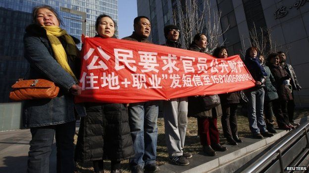 Supporters of Xu Zhiyong, one of China's most prominent rights advocates, shout slogans near a court where Mr Xu's trial is being held, in Beijing, 22 January 2014