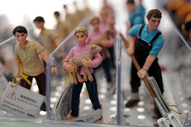 Toy farm workers are displayed at the London Toy Fair in Olympia, central London in 2013
