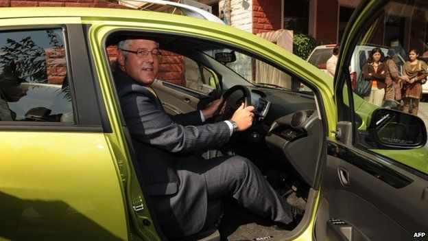 Karl Slym poses during the launch of a motor car in India in January 2010