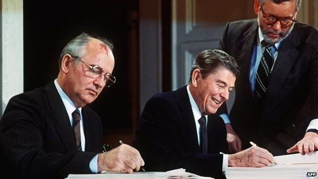 Mikhail Gorbachev and Ronald Reagan signing the INF treaty in 1987