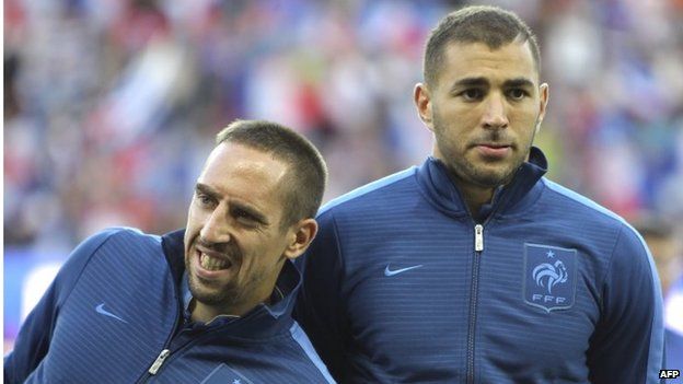 France's national football team forwards Franck Ribery, left, and Karim Benzema, right, before the start of the 2014 World Cup qualifying play-off second-leg football match between France and Ukraine at the Stade de France, outside Paris