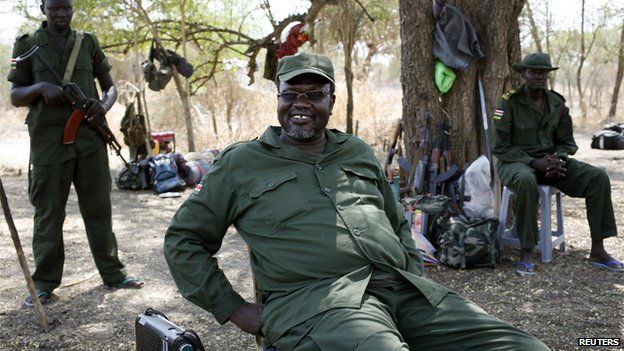 South Sudan's rebel leader Riek Machar sits near his men in a rebel-controlled territory in Jonglei State (January 31, 2014)