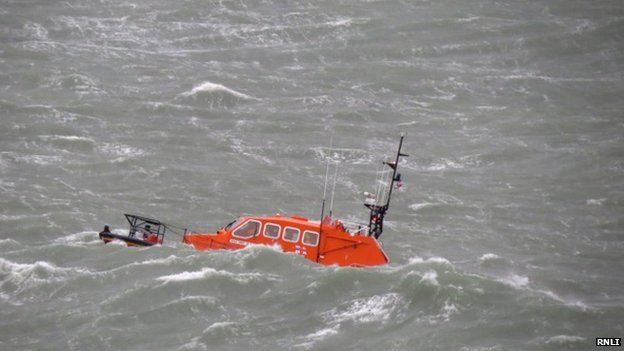 Weather warnings as rescuers search for missing angler - BBC News