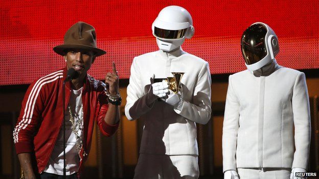 Pharrell Williams accepts the award for record of the year for Daft Punk for "Get Lucky" at the 56th annual Grammy Awards in Los Angeles