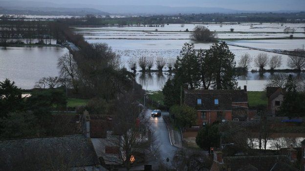 Flooded fields can be seen beside the A361