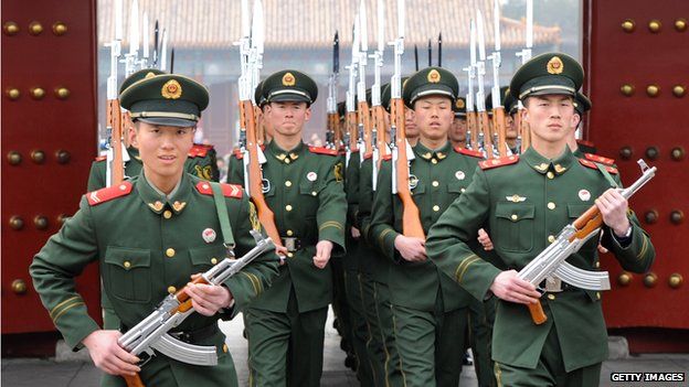 Chinese paramilitary soldiers train outside their barracks in Beijing on 19 March 2012
