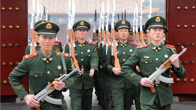 Chinese paramilitary soldiers train outside their barracks in Beijing on 19 March 2012