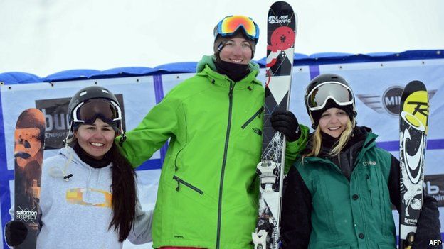 US Alexi Micinski (centre), US Julia Marino (left) and New Zealand's Anna Willcox-Silfverberg (eight) pose on the podium of the Ladies' Slopestyle race at the Snowboard and Freestyle World Cup Super finals at Sierra Nevada ski resort near Granada on 22 March, 2013