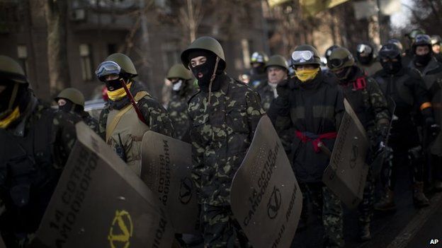 Opposition supporters march toward the parliament in Kiev, Ukraine, Thursday, Feb. 6, 2014.