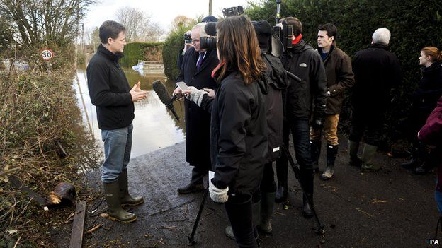 Deputy Prime Minister Nick Clegg is interviewed by the media next to the flooding sites at Burrowbridge, Somerset