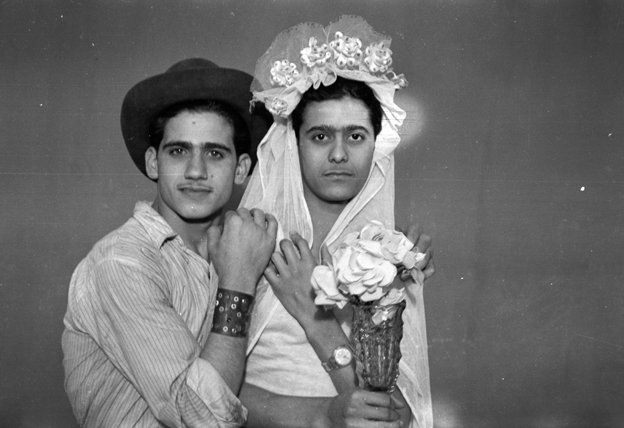 two boys pose as bride and groom
