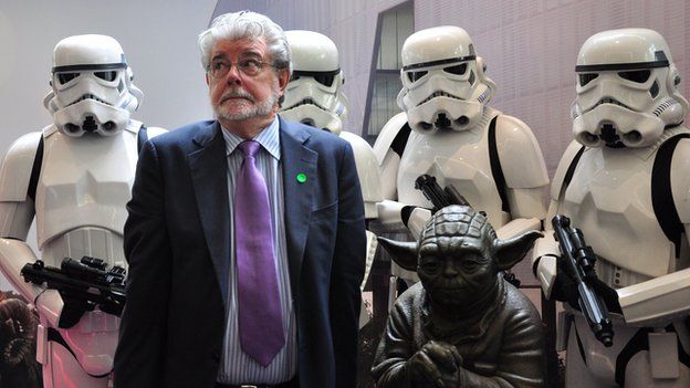 George Lucas with Stormtroopers and a statue of Yoda at the opening of ILM's facility in Singapore