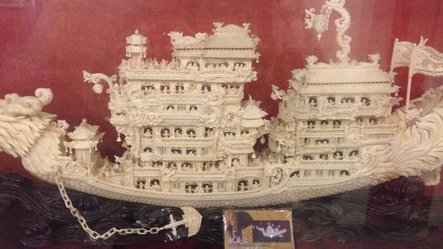 A carved ivory ship model, with an ID card that does not match, in a legal ivory shop